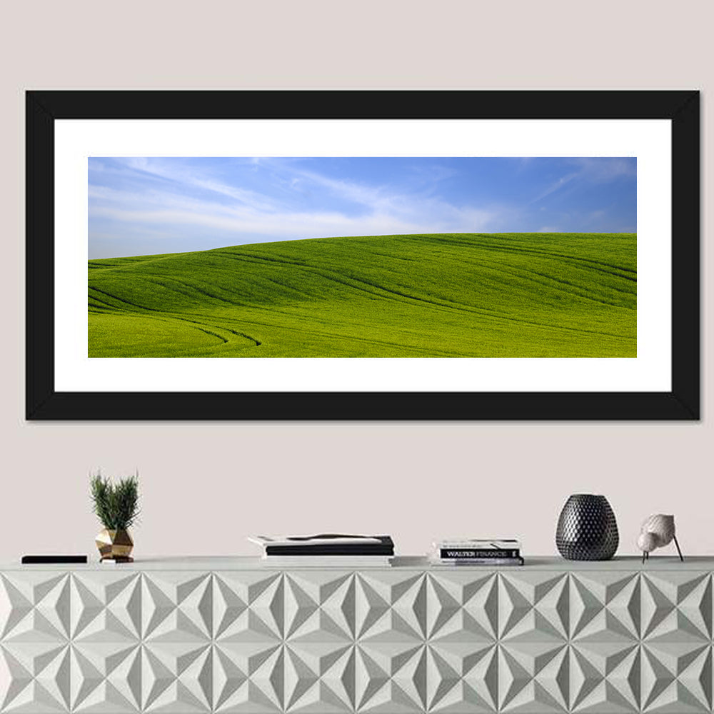 Rolling Green Hill with Blue Sky Wall Art in a room, panoramic
