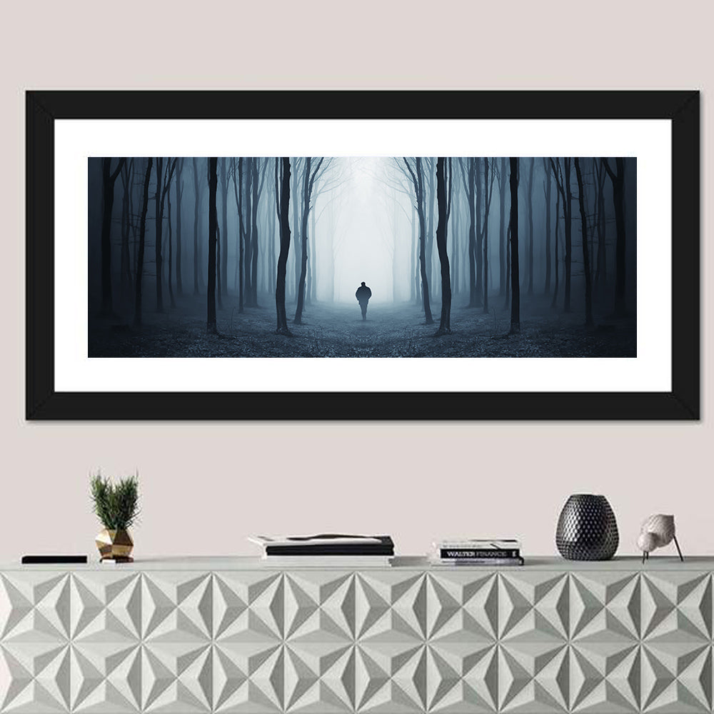 Lone Figure in Misty Forest Wall Art in a room, panoramic