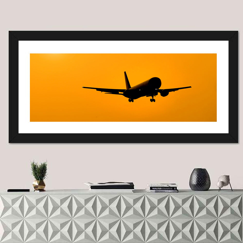 Golden Hour Airliner Silhouette Wall Art in a room, panoramic