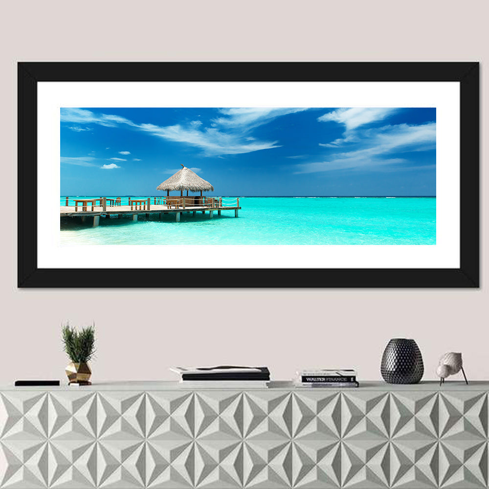 Thatched Beach Bar Pier Wall Art in a room, panoramic