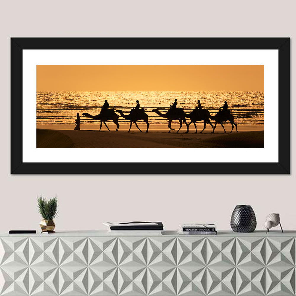 Camel Caravan Silhouette on Wet Sand Wall Art in a room, panoramic