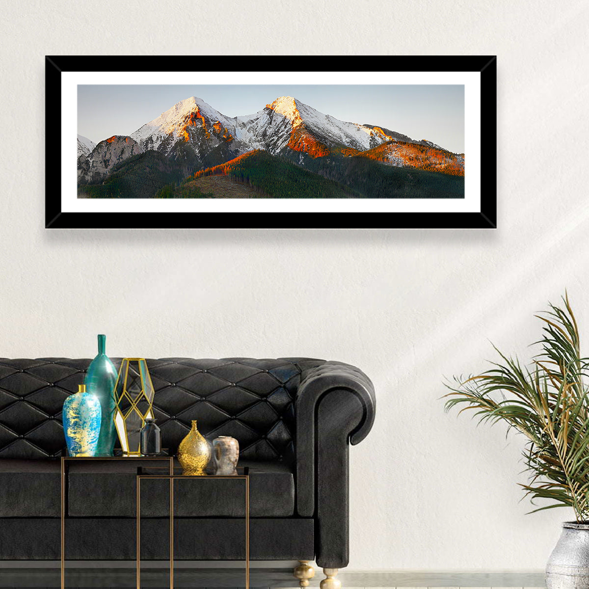 Sunlit Snow Capped Peaks Wall Art in a room, panoramic