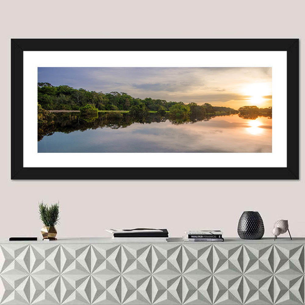 Amazon River Sunset Reflection Wall Art in a room, panoramic