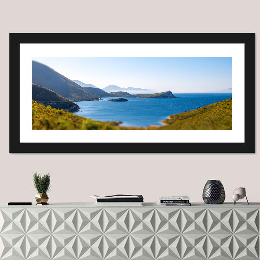 Coastal Cliffs and Lighthouse Bay Wall Art in a room, panoramic