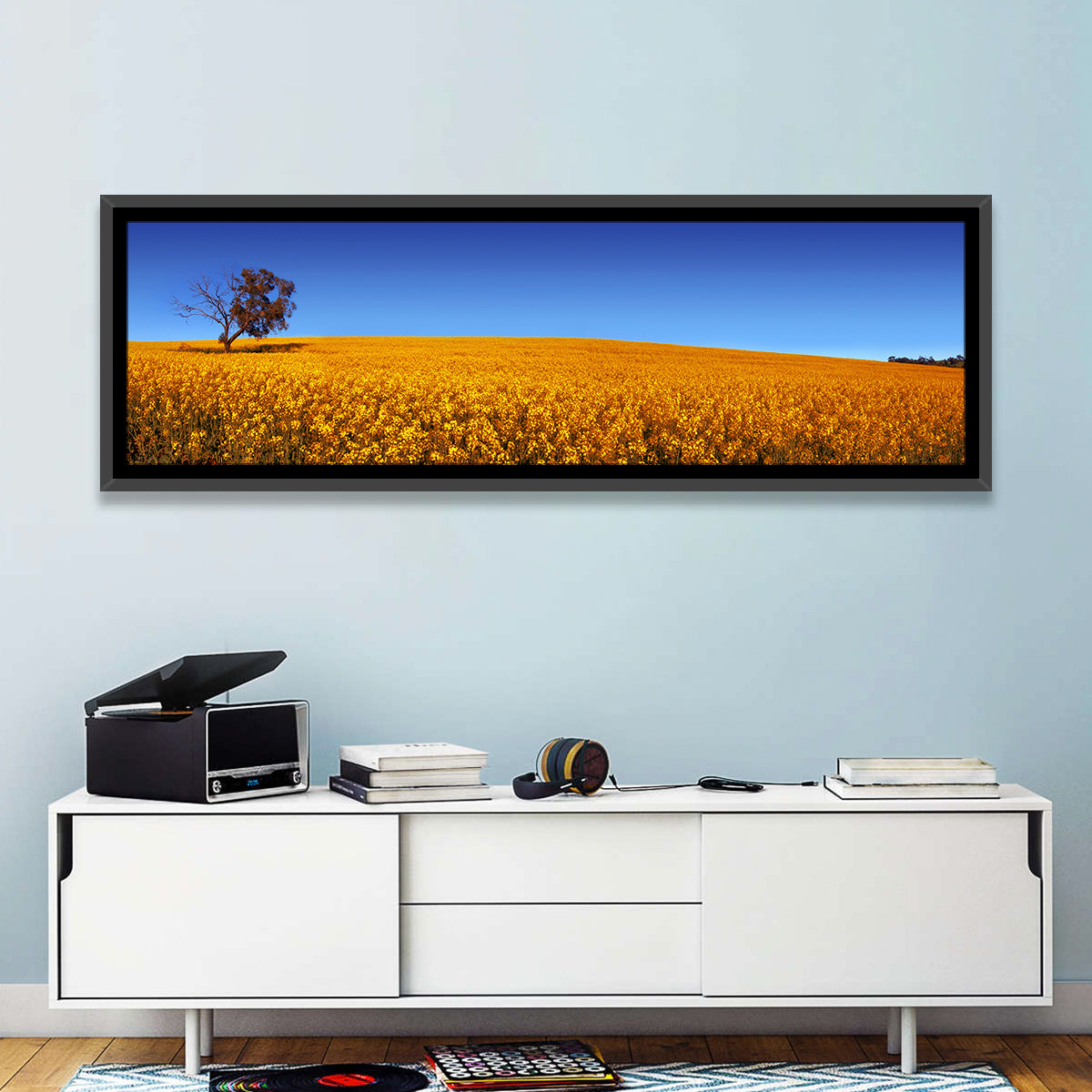 Canola Field with Lone Tree Wall Art in a room, panoramic