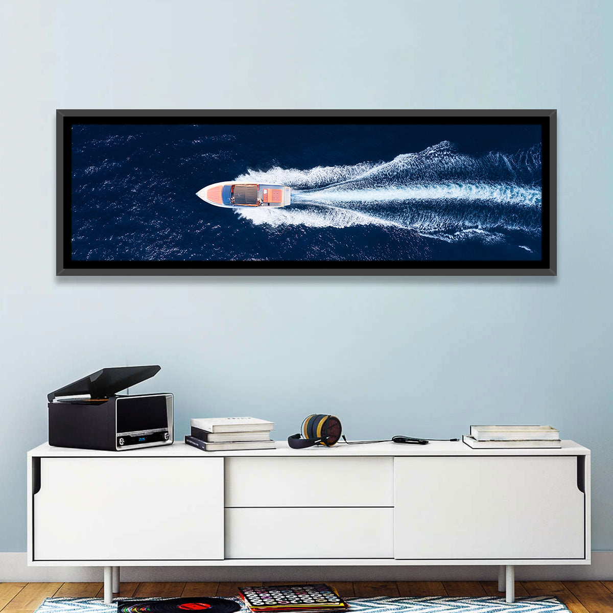 Sleek Speedboat Over Navy Sea Wall Art in a room, panoramic