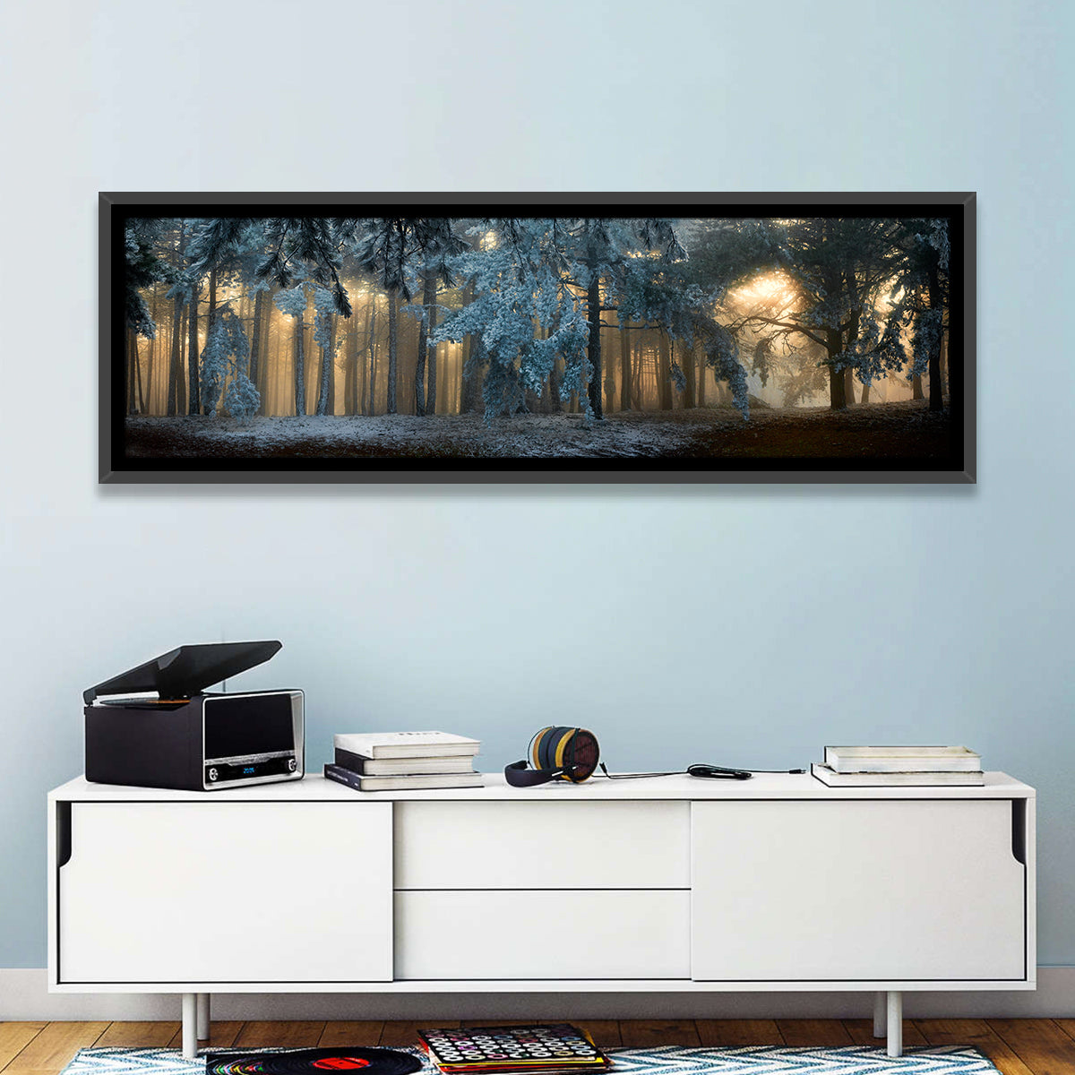 Sunlit Snow Covered Forest Wall Art in a room, panoramic