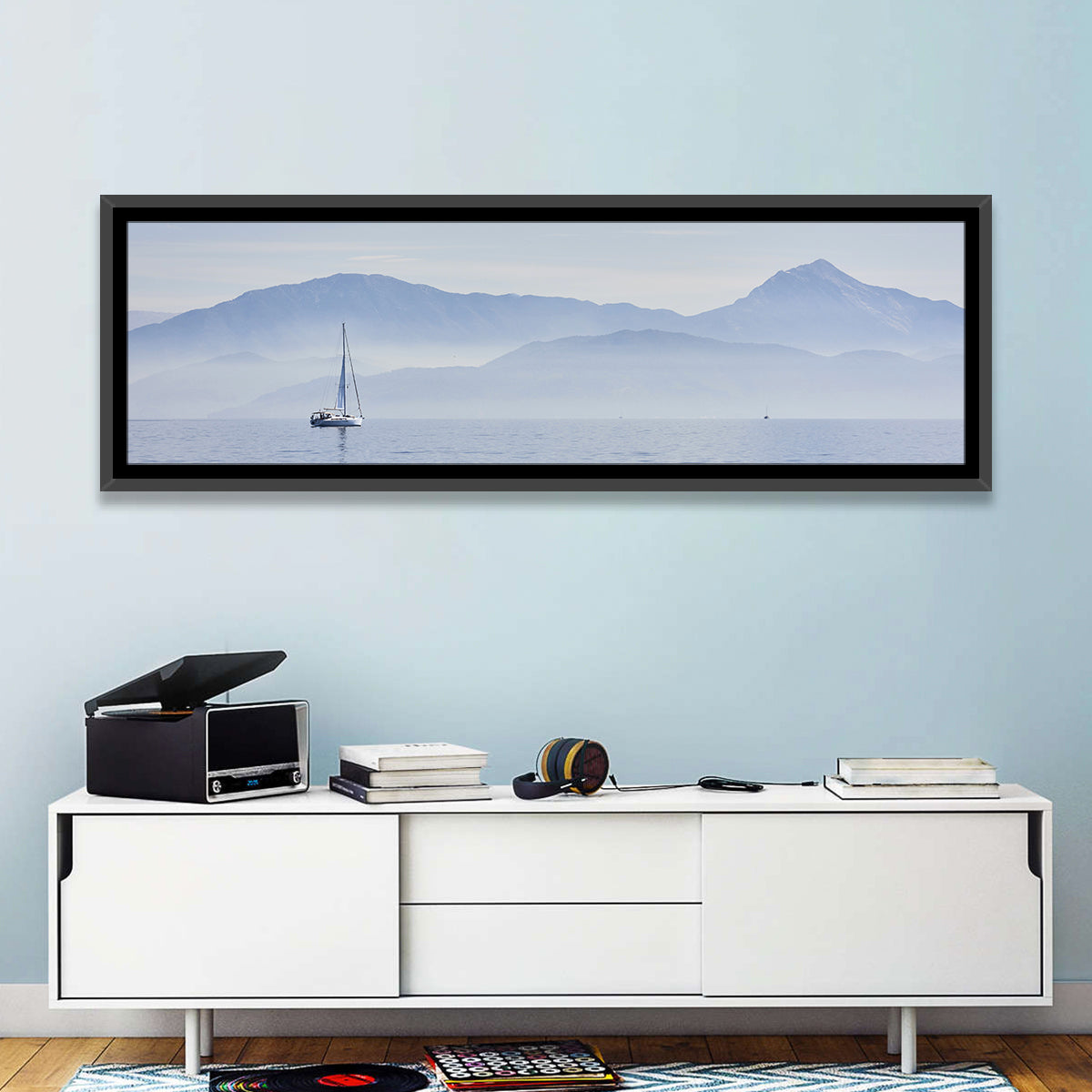 Sailboat and Misty Mountains Wall Art in a room, panoramic