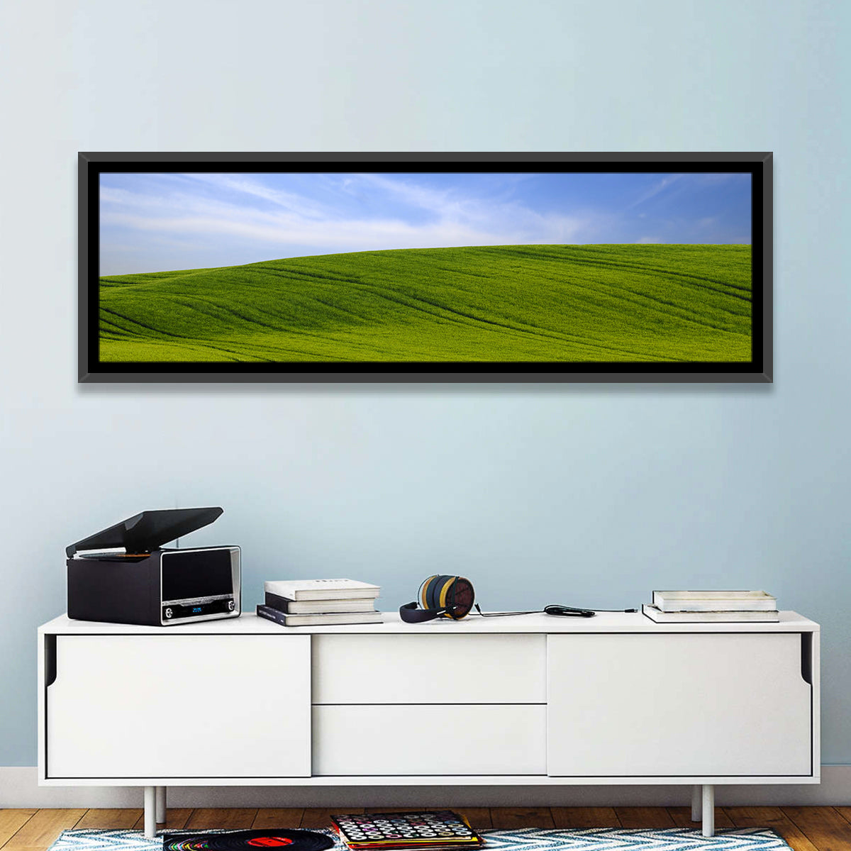 Rolling Green Hill with Blue Sky Wall Art in a room, panoramic
