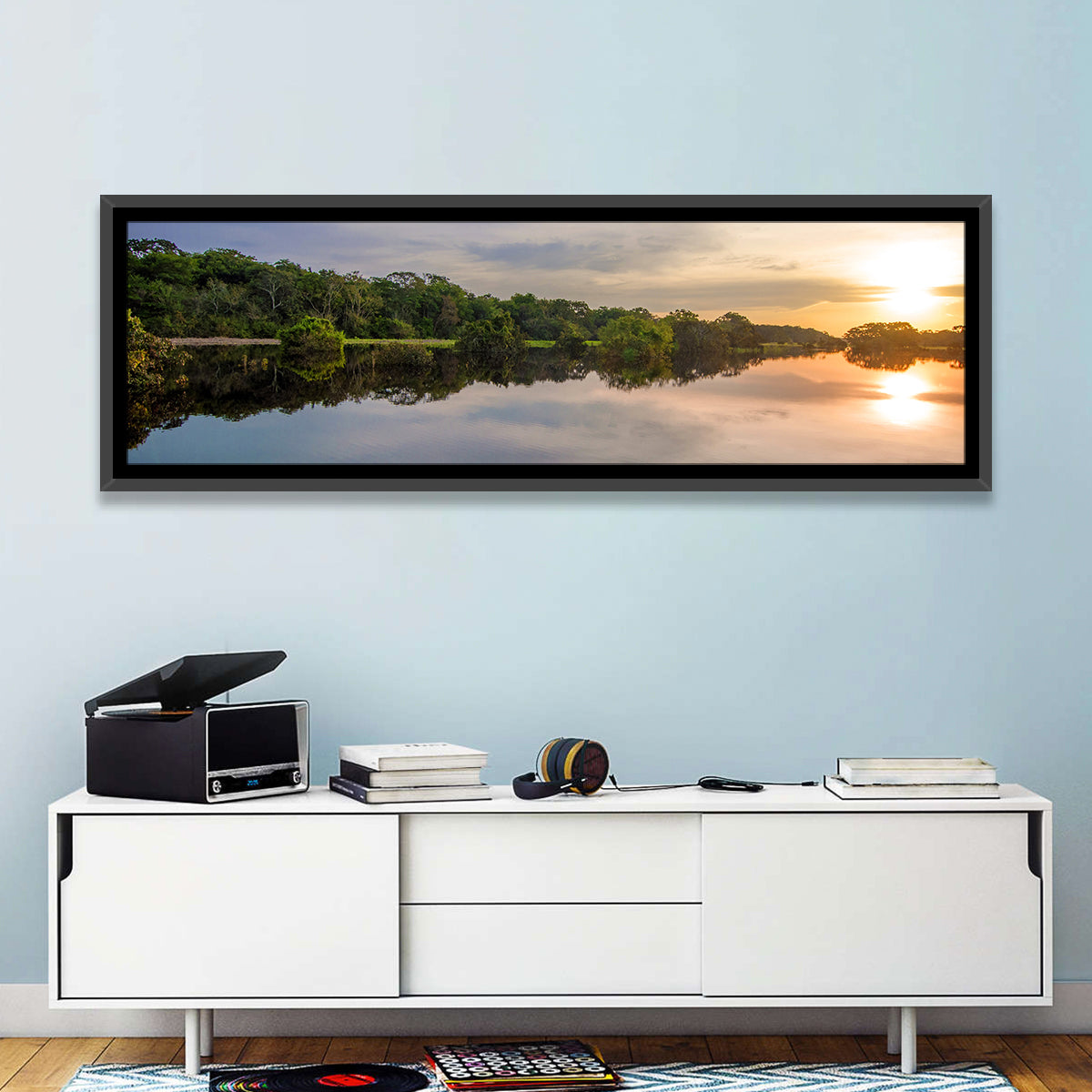 Amazon River Sunset Reflection Wall Art in a room, panoramic