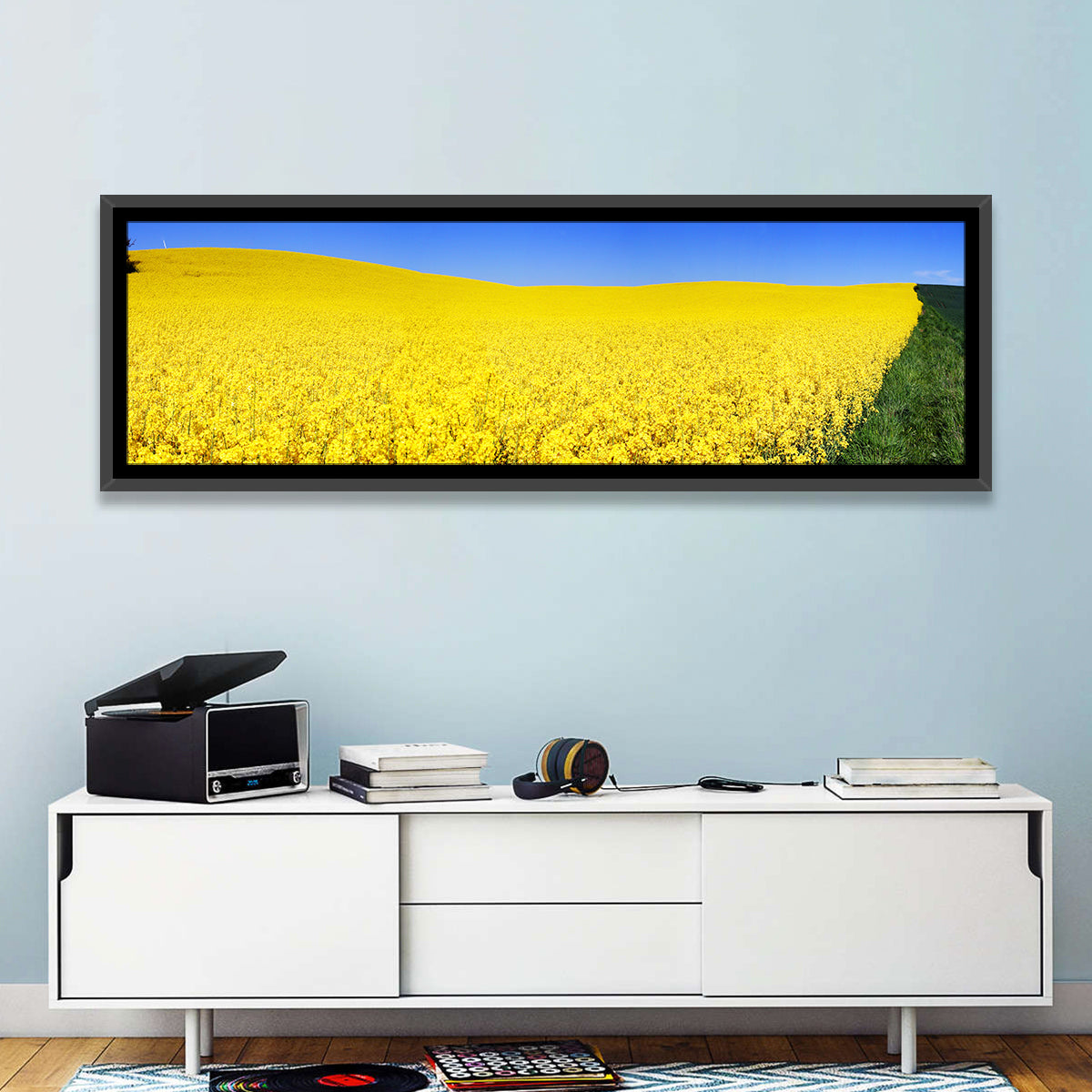 Sunlit Rapeseed Field Wall Art in a room, panoramic