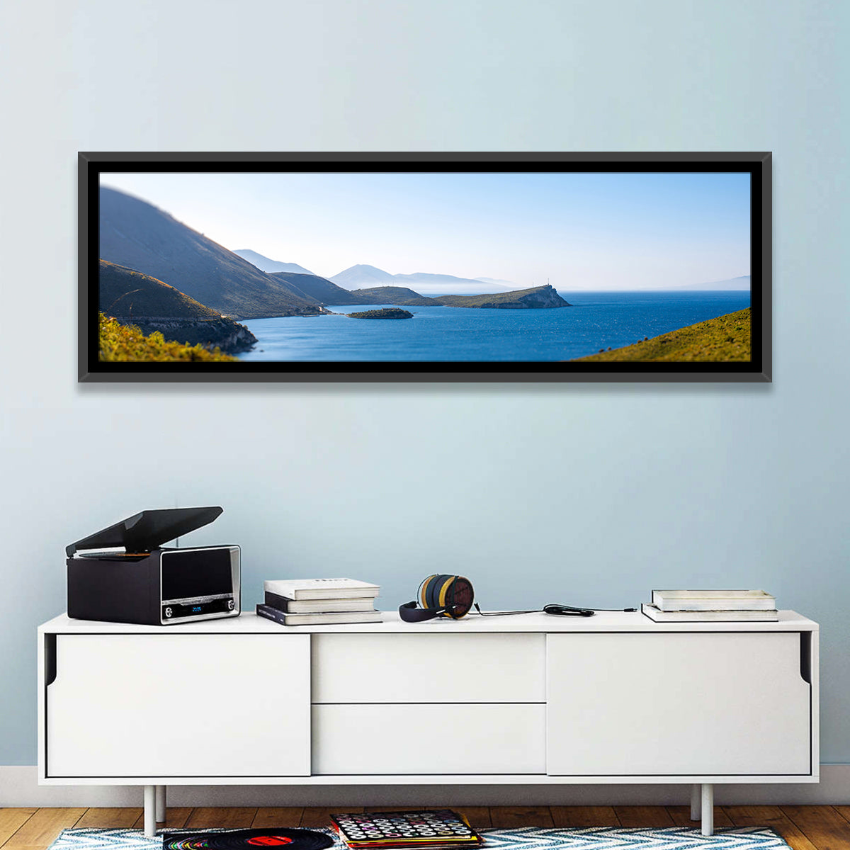 Coastal Cliffs and Lighthouse Bay Wall Art in a room, panoramic