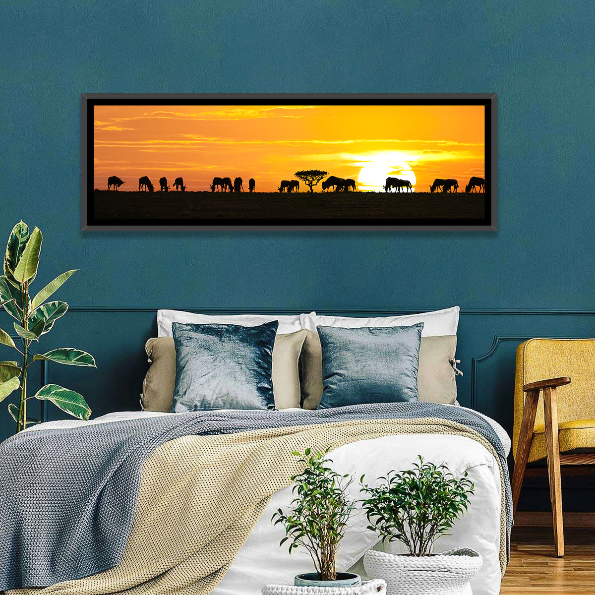 Wildebeest Silhouettes at Sunset Wall Art in a room, panoramic