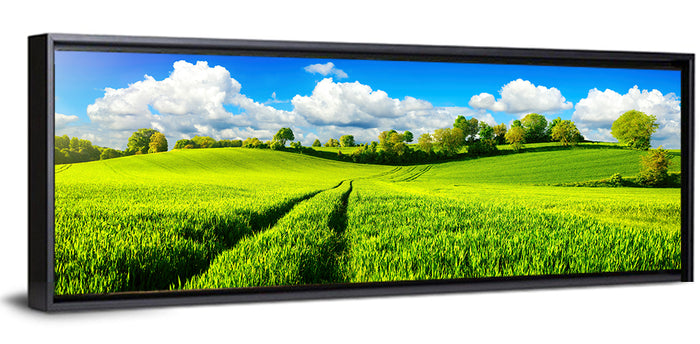 Tractor Tracks Through Green Rolling Hills Wall Art as a framed canvas