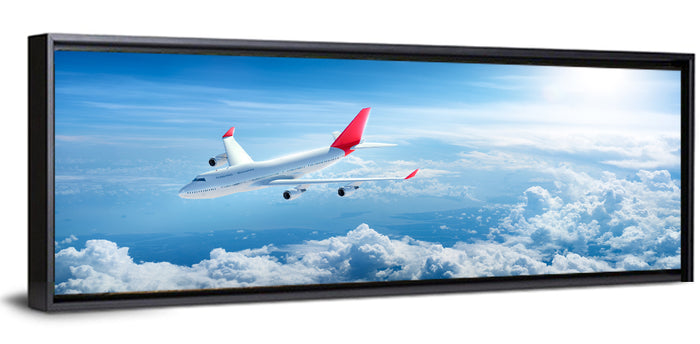 Airplane Over Blue Cloudscape Wall Art as a framed canvas
