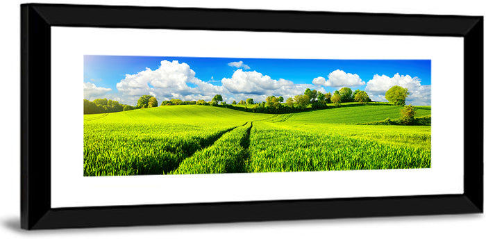 Tractor Tracks Through Green Rolling Hills Wall Art as a framed print