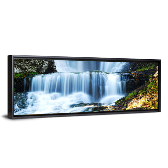 White Waterfall Over Mossy Rocks Wall Art as a framed canvas