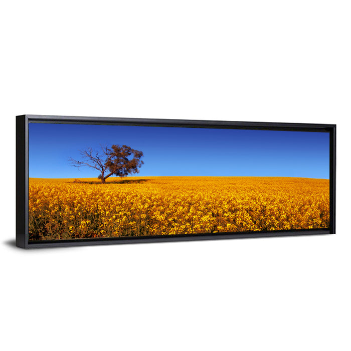 Canola Field with Lone Tree Wall Art as a framed canvas
