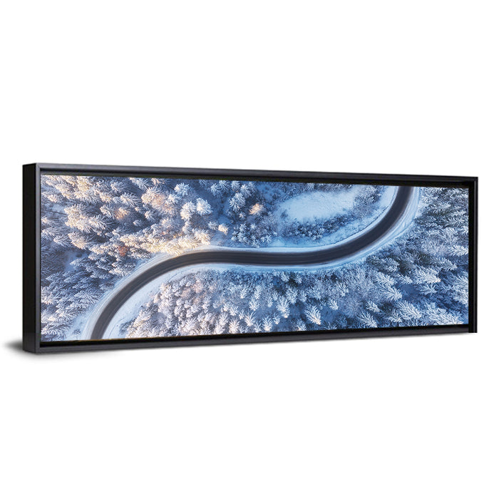 Winding Snow-covered Forest Road Wall Art as a framed canvas
