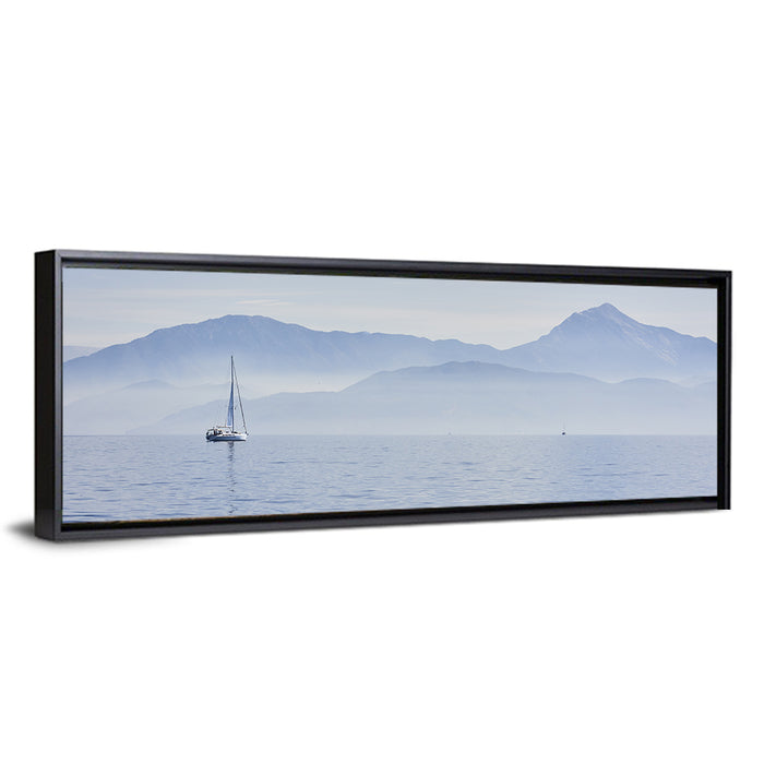 Sailboat and Misty Mountains Wall Art as a framed canvas