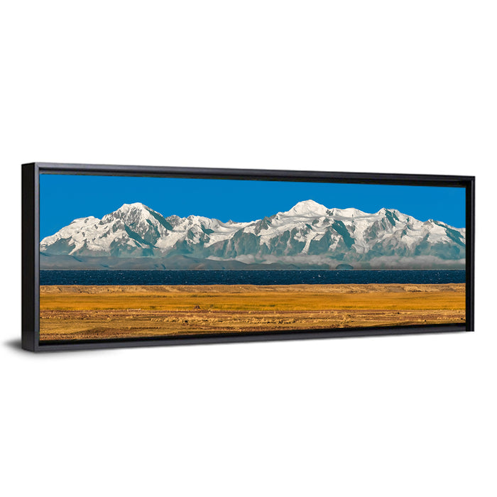 Snow-capped Peaks Over Lake Titicaca Wall Art as a framed canvas