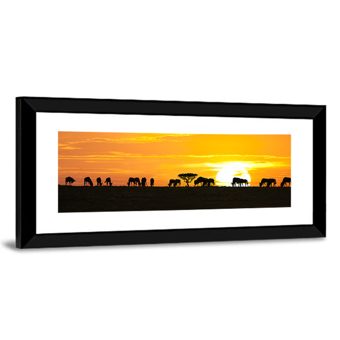 Wildebeest Silhouettes at Sunset Wall Art as a framed print