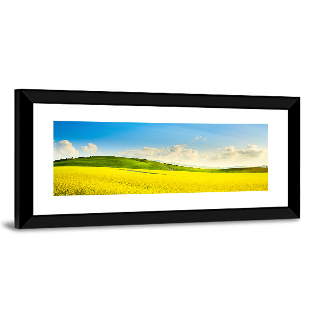 Rapeseed Field and Rolling Hills Under Blue Sky Wall Art