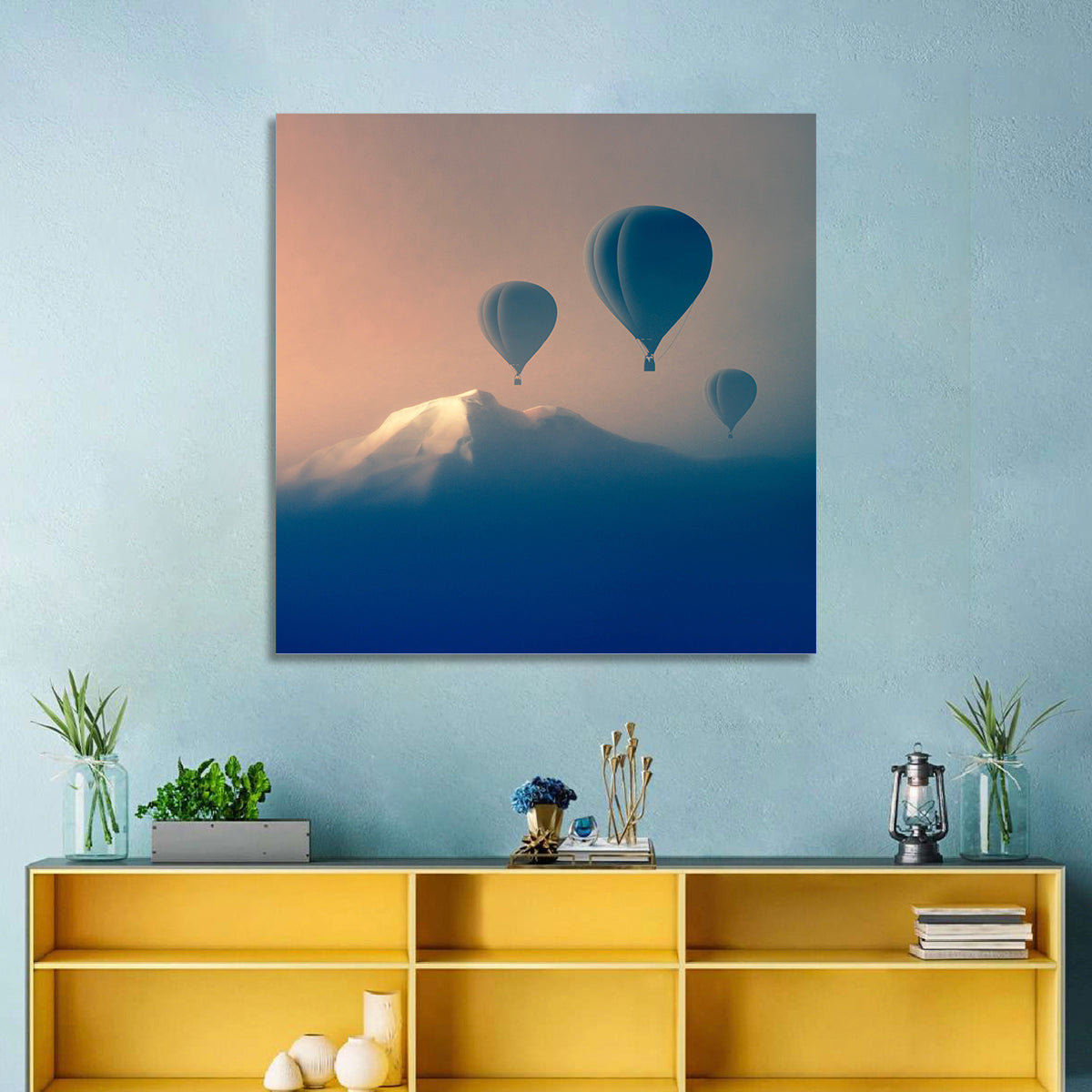 Three Hot Air Balloons Over Misty Peak Wall Art in a room, square
