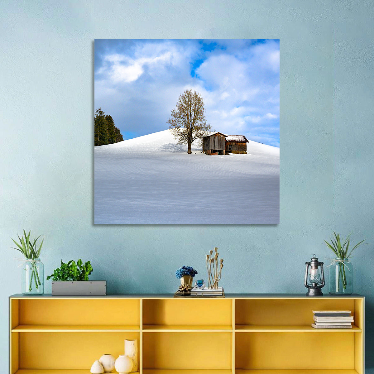 Rustic Barn on a Snowy Hill Wall Art in a room, square