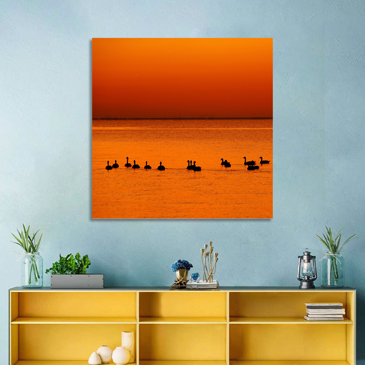 Geese Silhouettes at Orange Sunset Wall Art in a room, square