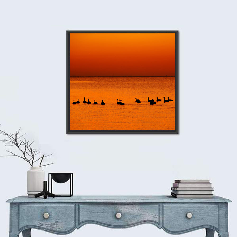Geese Silhouettes at Orange Sunset Wall Art in a room, square