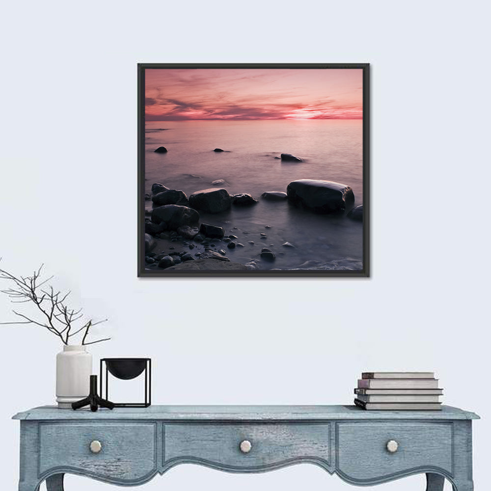 Pink Dusk Lakeshore with Silhouetted Rocks Wall Art in a room, square