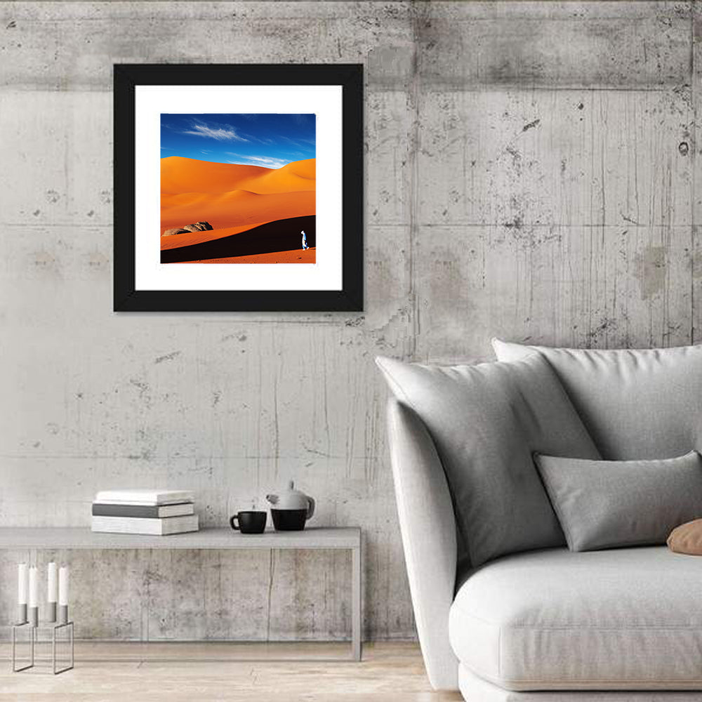 Solitary Figure on Sahara Dunes Wall Art in a room, square
