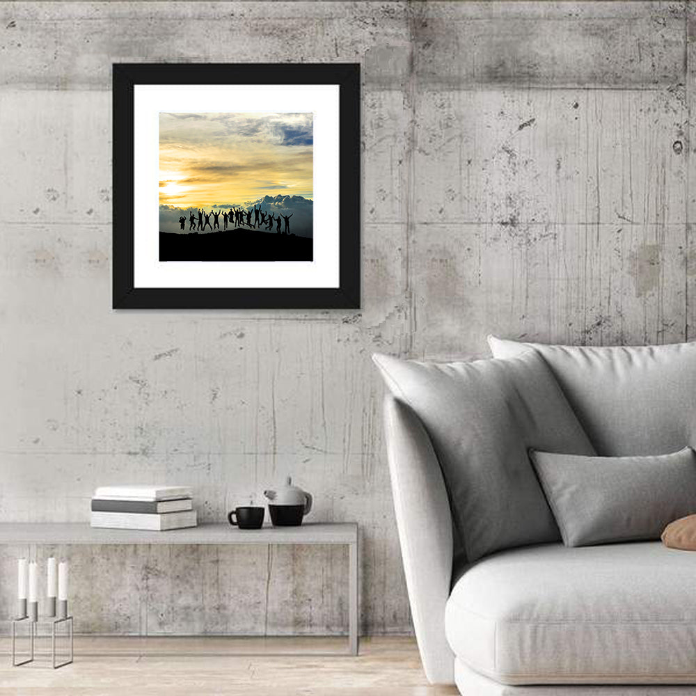 Golden Team Silhouettes at Sunset Wall Art in a room, square