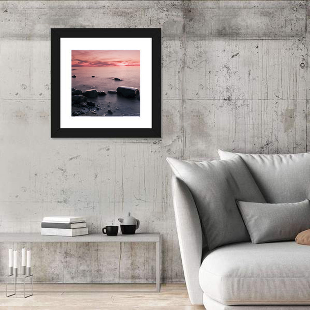 Pink Dusk Lakeshore with Silhouetted Rocks Wall Art in a room, square