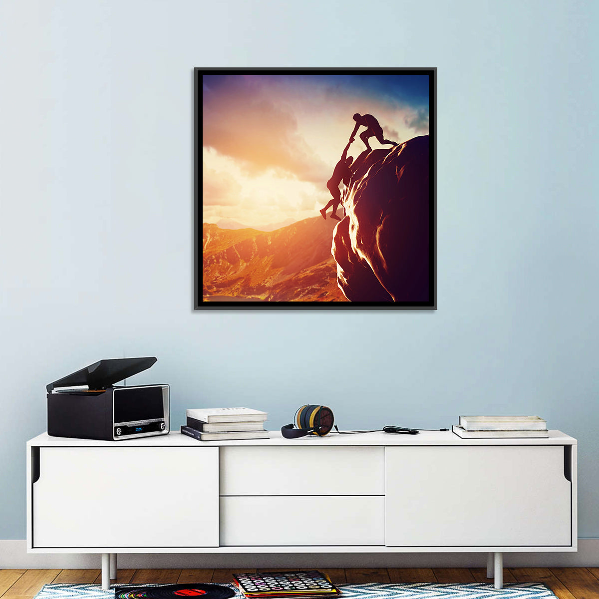 Two Hikers Summit Assist at Sunset Wall Art in a room, square