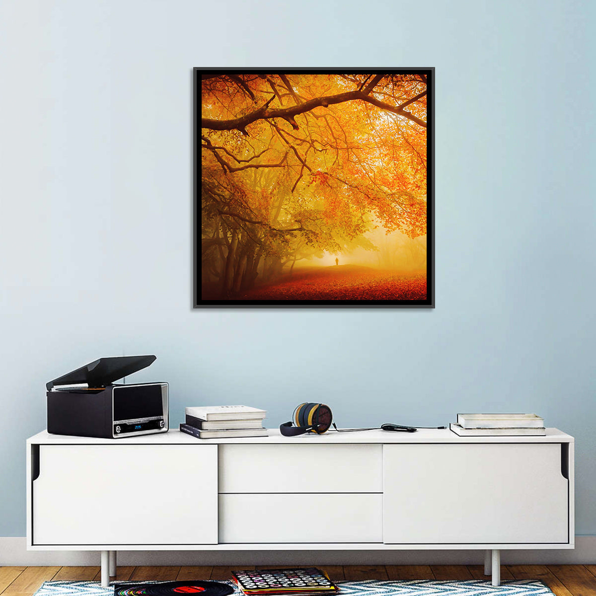Autumn Forest Path with Lone Figure Wall Art in a room, square