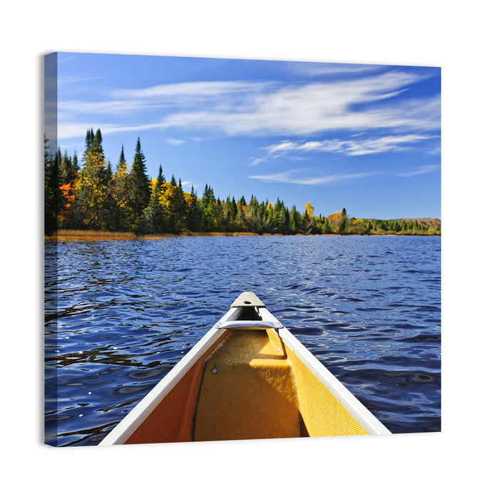 Yellow Canoe Bow on Blue Lake Wall Art as a canvas print