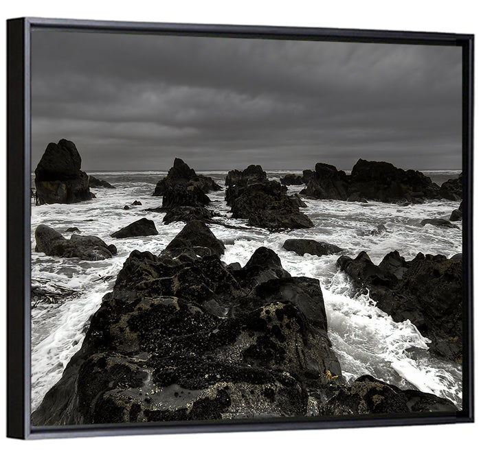 Moody Black and White Rocky Coast Waves Wall Art as a framed canvas