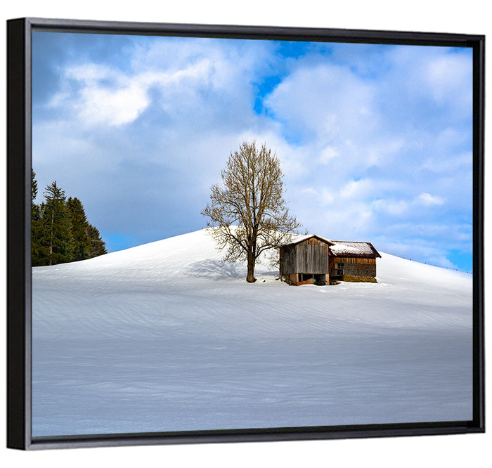 Rustic Barn on a Snowy Hill Wall Art as a framed canvas