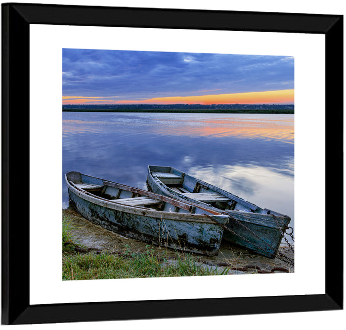 Chained Rowboats at Dusk Wall Art as a framed print