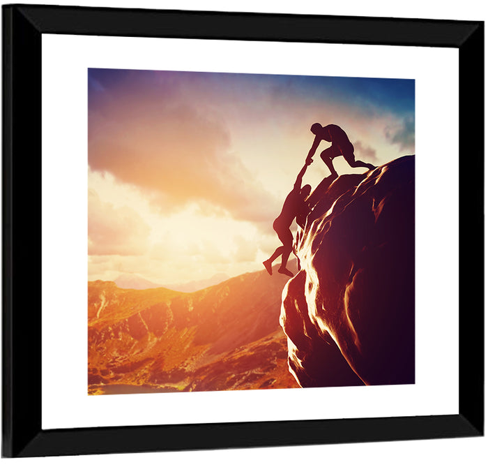 Two Hikers Summit Assist at Sunset Wall Art as a framed print