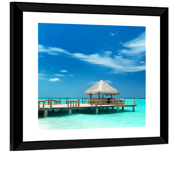 Thatched Beach Bar Pier Wall Art as a framed print