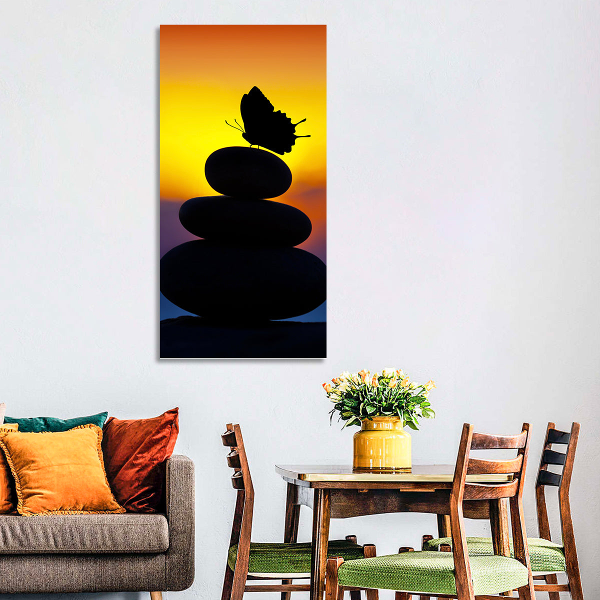 Stacked Spa Stones with Butterfly Wall Art in a room, portrait