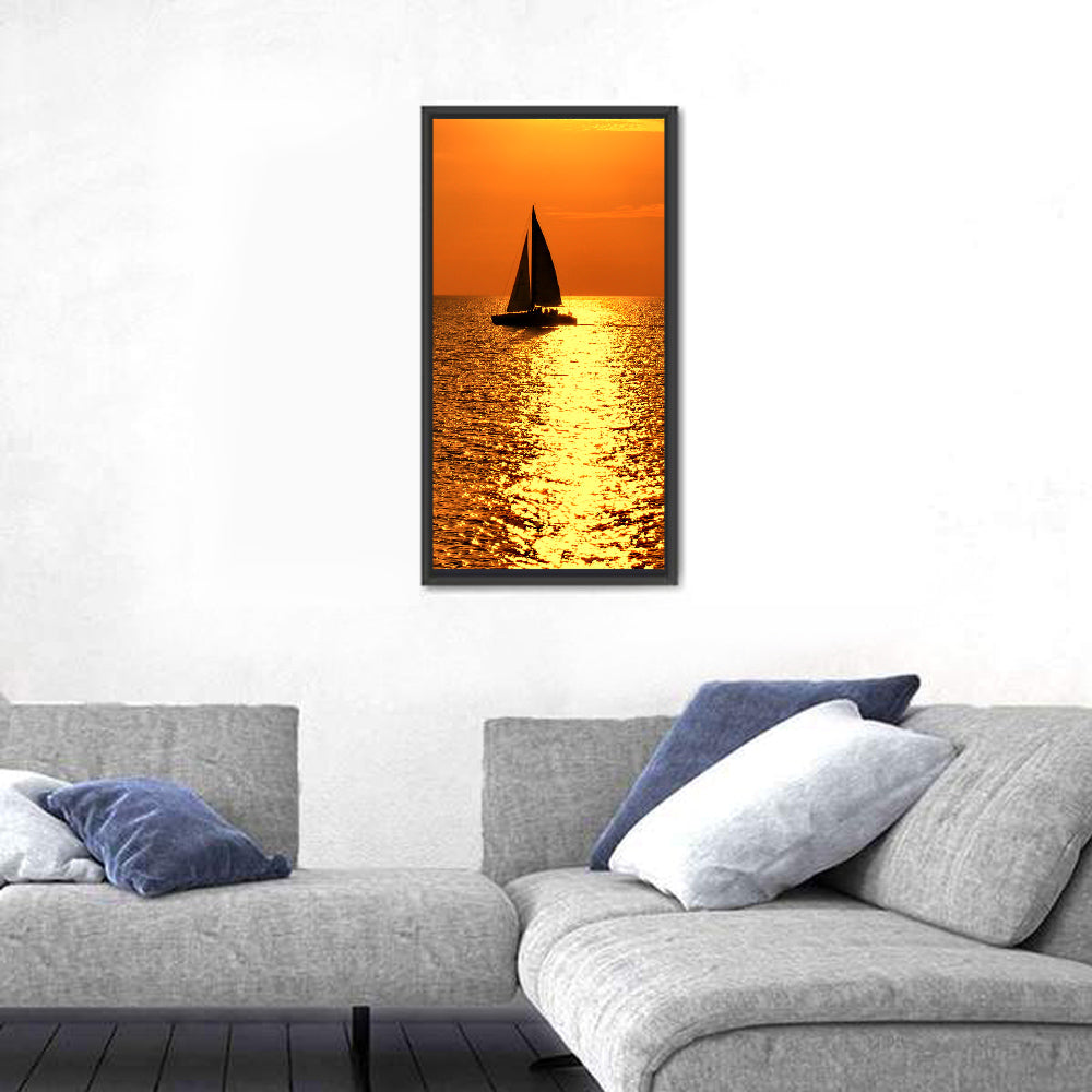 Sailboat Silhouette at Golden Sunset Wall Art in a room, portrait