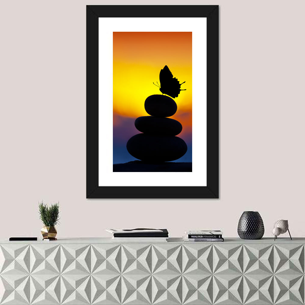 Stacked Spa Stones with Butterfly Wall Art in a room, portrait