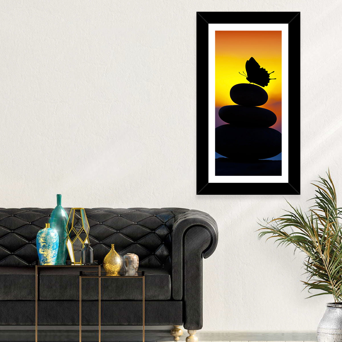 Stacked Spa Stones with Butterfly Wall Art in a room, portrait