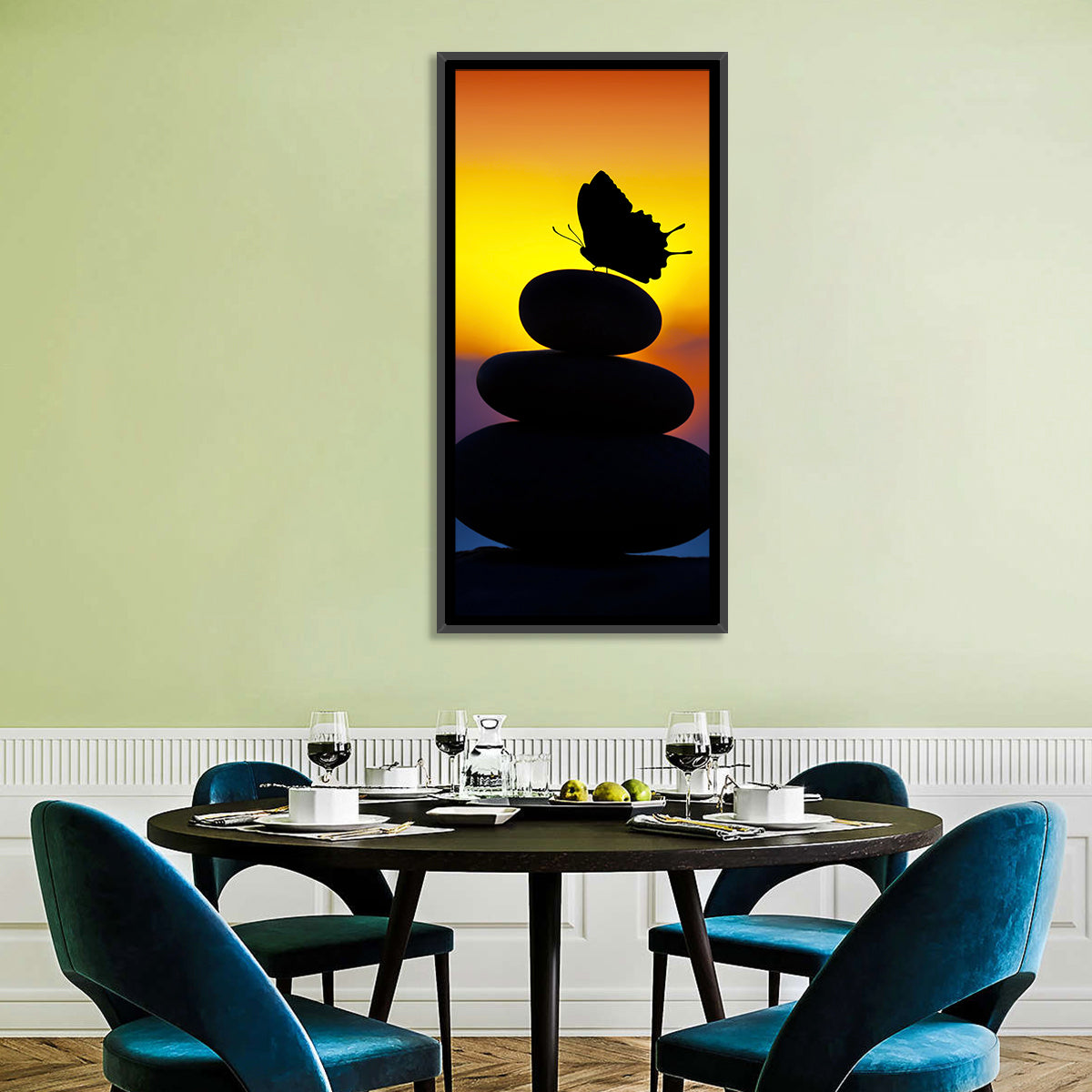 Stacked Spa Stones with Butterfly Wall Art in a room, portrait